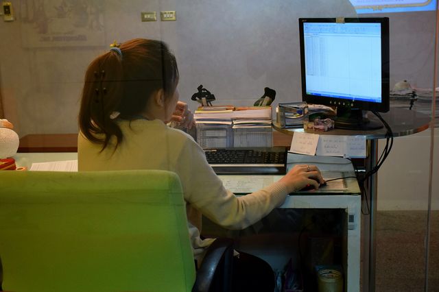 working. woman typing on a pc computer 