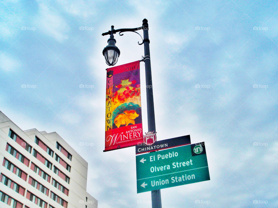 sky sign clouds building by analia