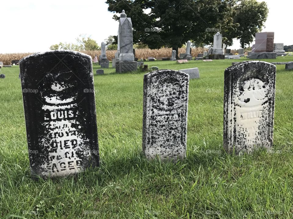 Three very old headstones