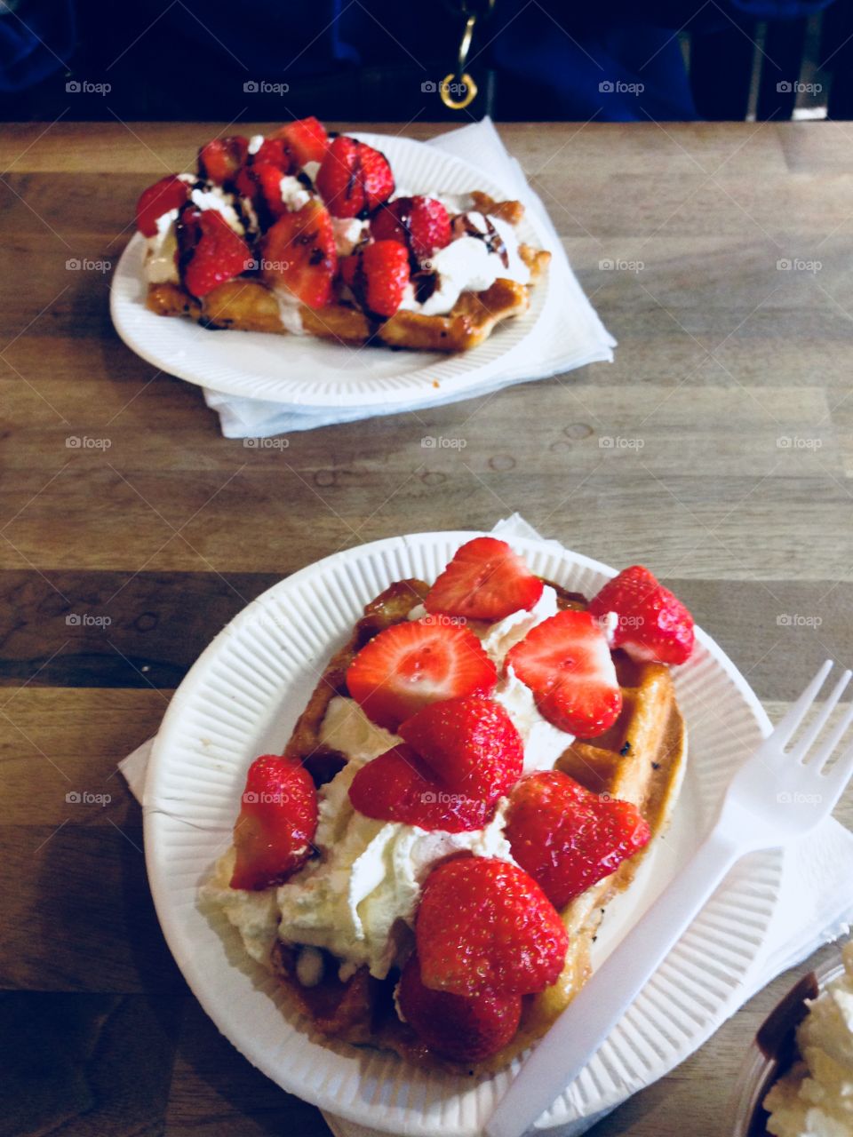 Strawberries, cream and waffles, street food.