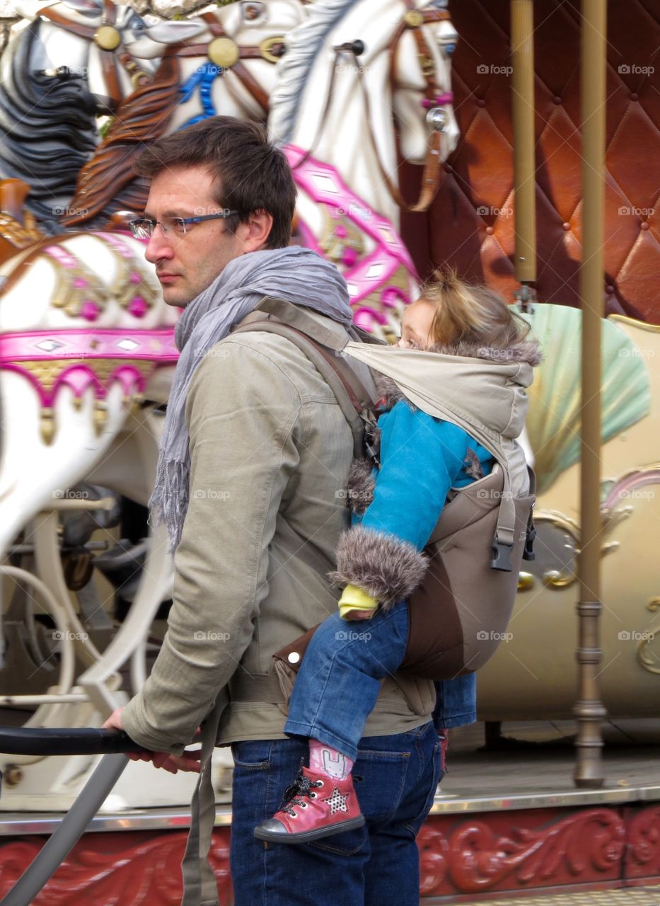 Father and daughter at the carrousel in Montmartre