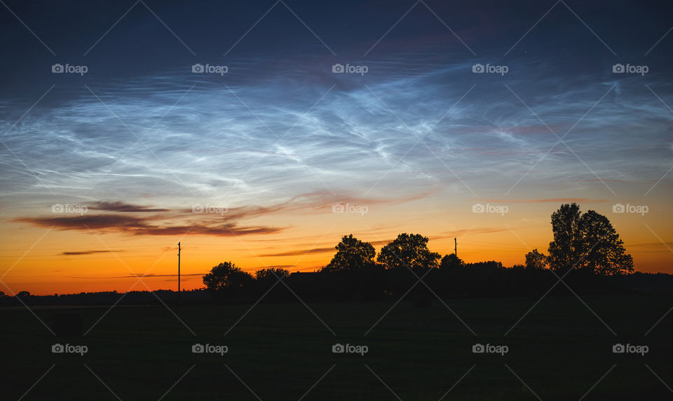 Magic night sky with noctilucent clouds