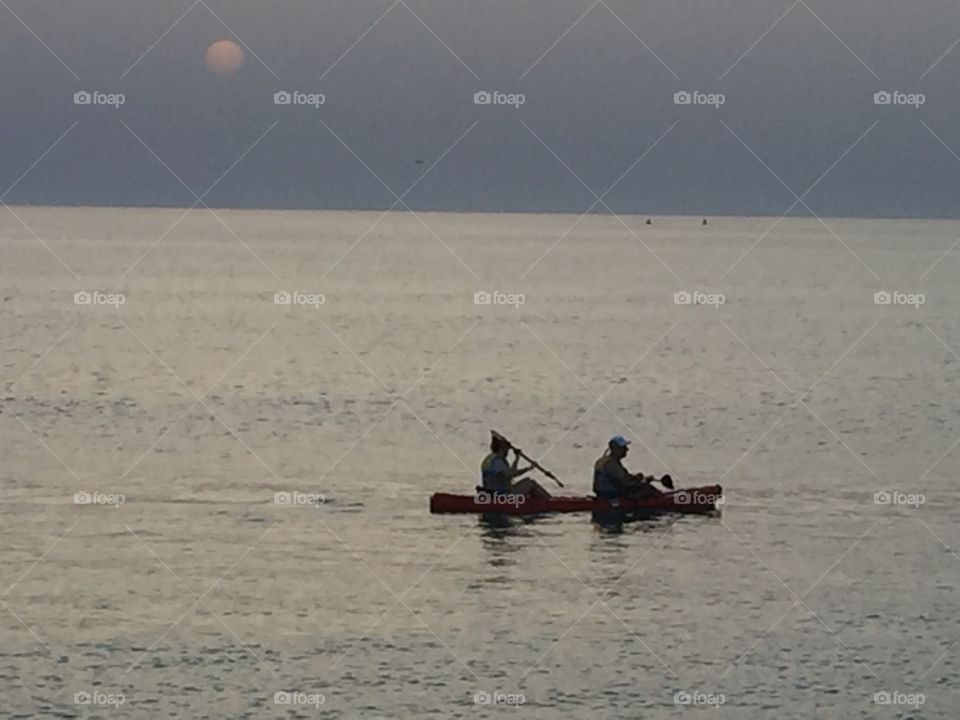 Bahrain Budaiya beach seafront. Couple in their own world