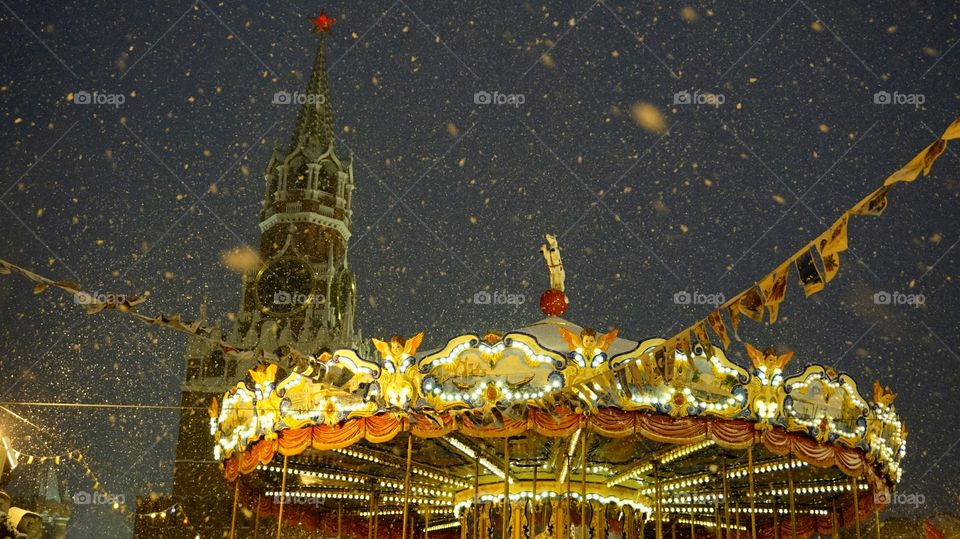 Carousel ride illuminated at night
