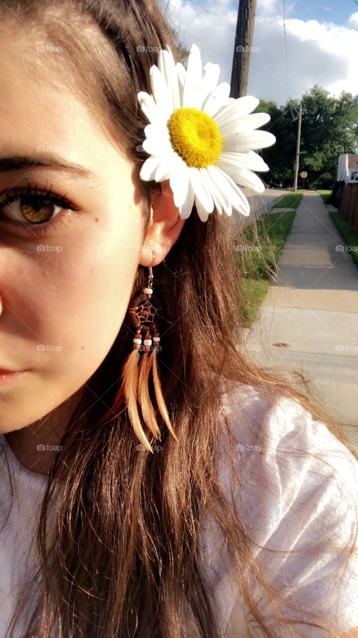 With love in her eyes and flowers in her hair 