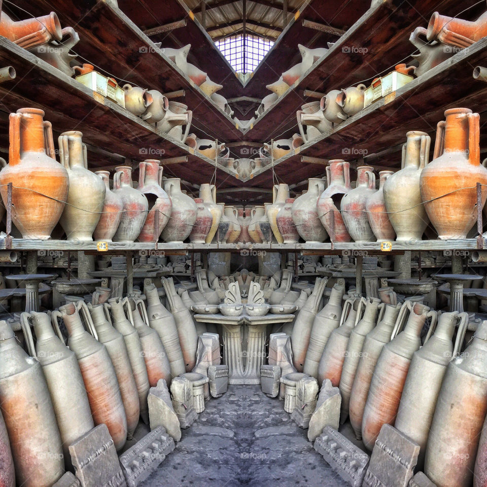 Archaeological workroom with clay pots and urns uncovered at Pompeii 