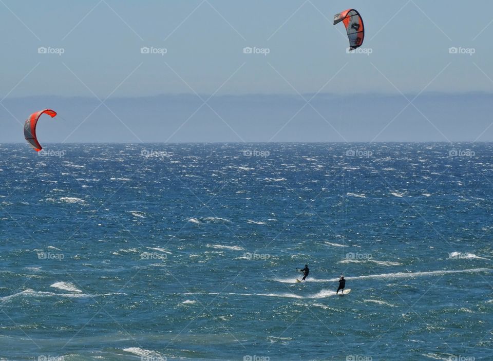 Windsurfing In California. Windsurfers In The Ocean Off The California Coast
