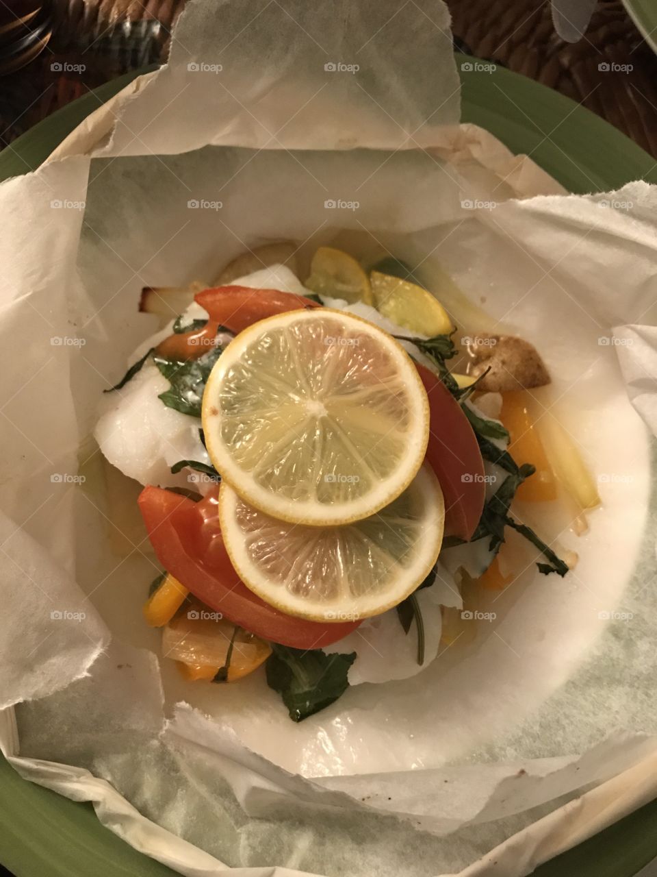Fish baked in a parchment paper 