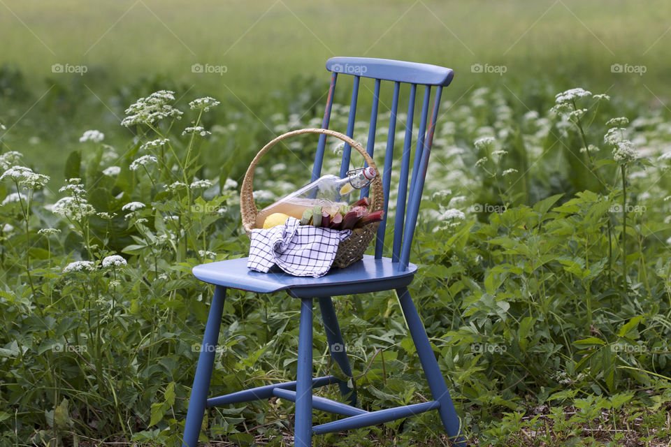 light raspberry juice and blue chair