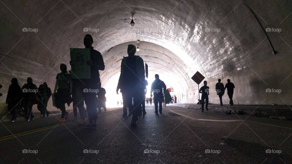 A protest passes through a tunnel
