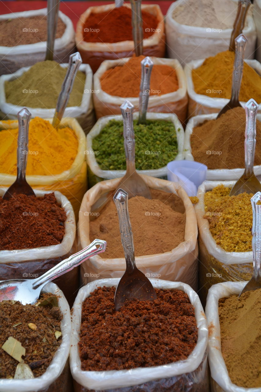spices for sale at a roadside market, india