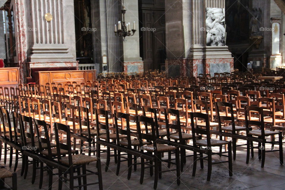 Wooden chairs. Inside one of paris churchs