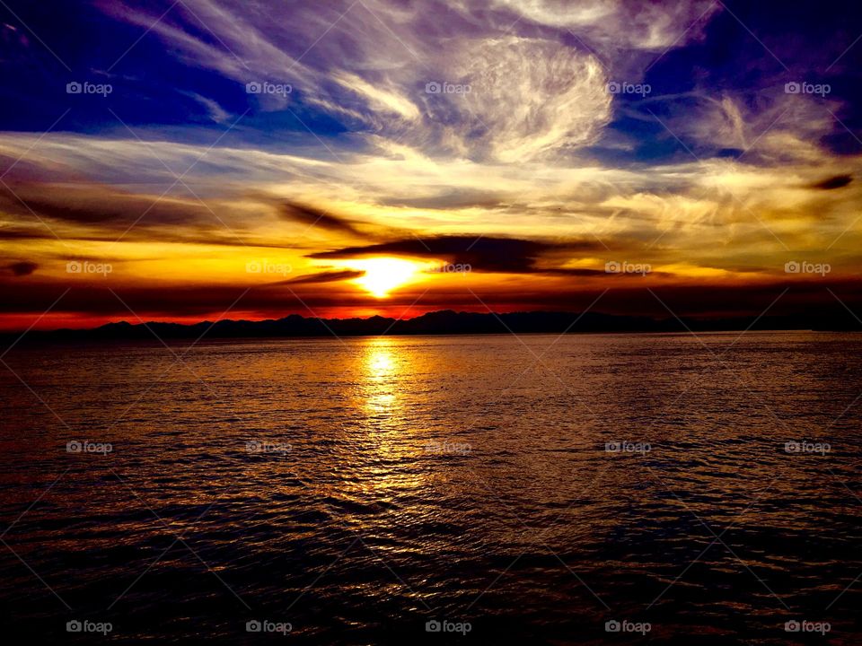 Evening sun rays through the storm clouds