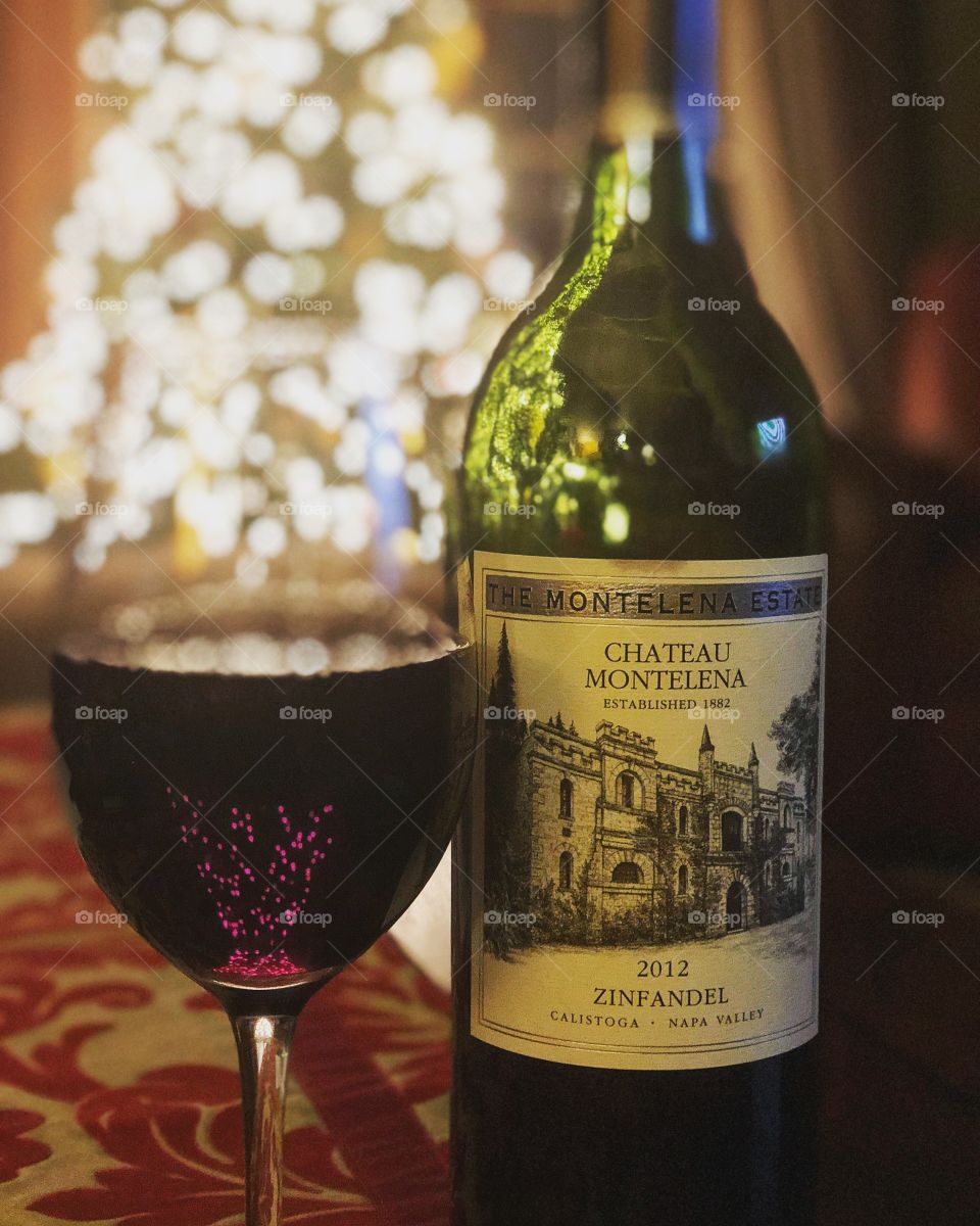 Glass of wine, Chateau Montalena Zinfandel against  Christmas tree lights