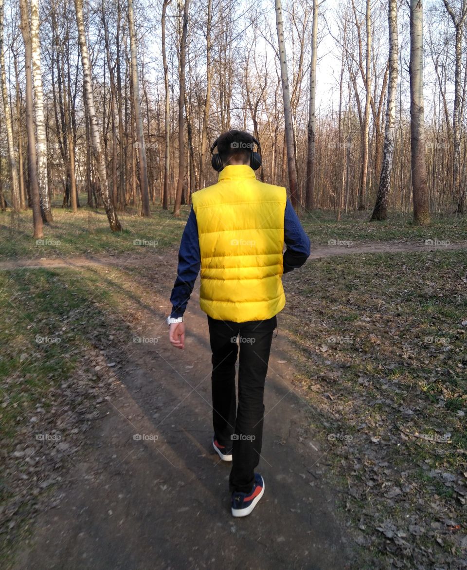 boy walking in the park landscape