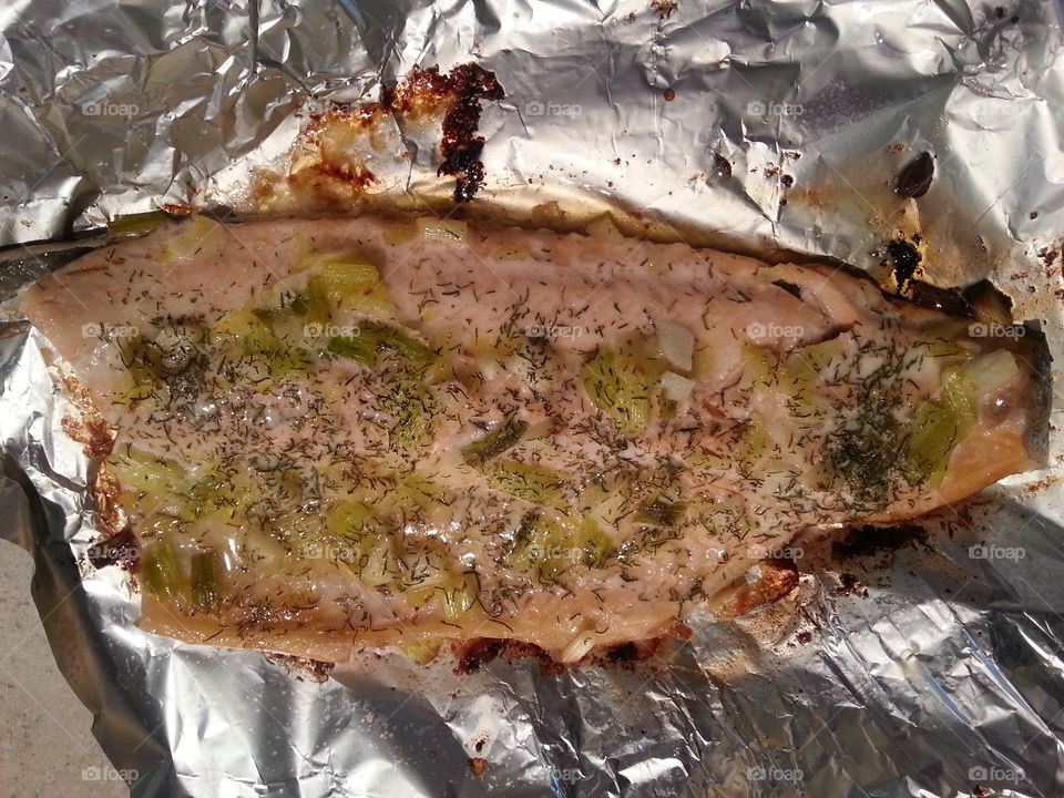 Baked rainbow trout. Baked rainbow trout topped  with butter, onion, lemon and dill