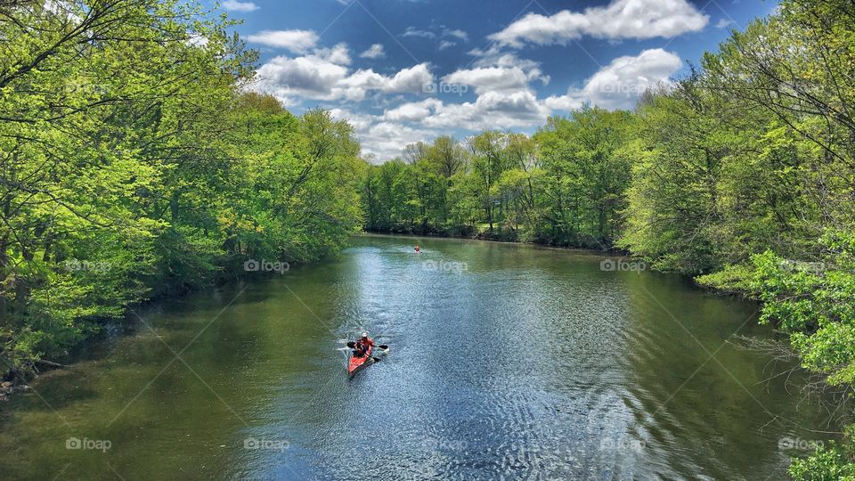 A person kayaking in the river