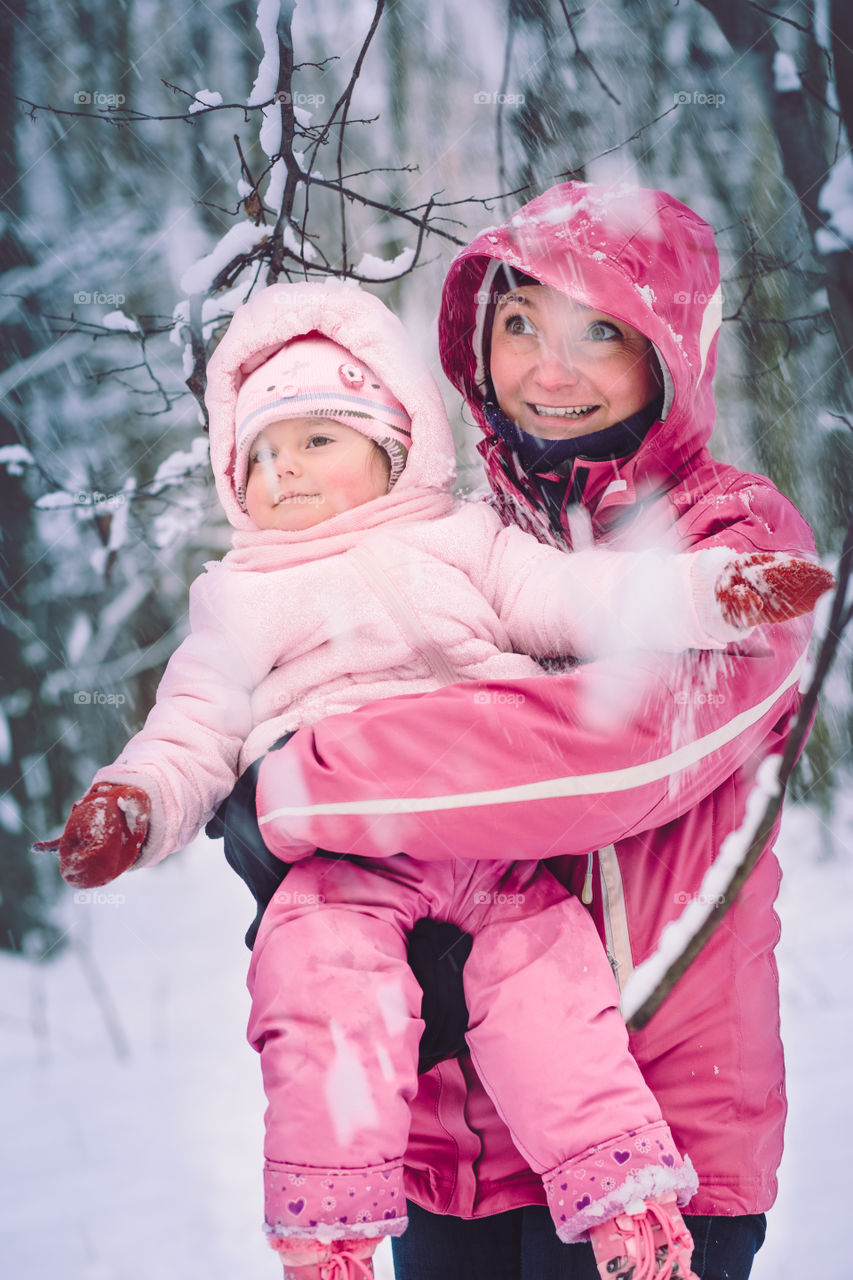 Winter with friends. Spending wintertime outdoors playing with snow