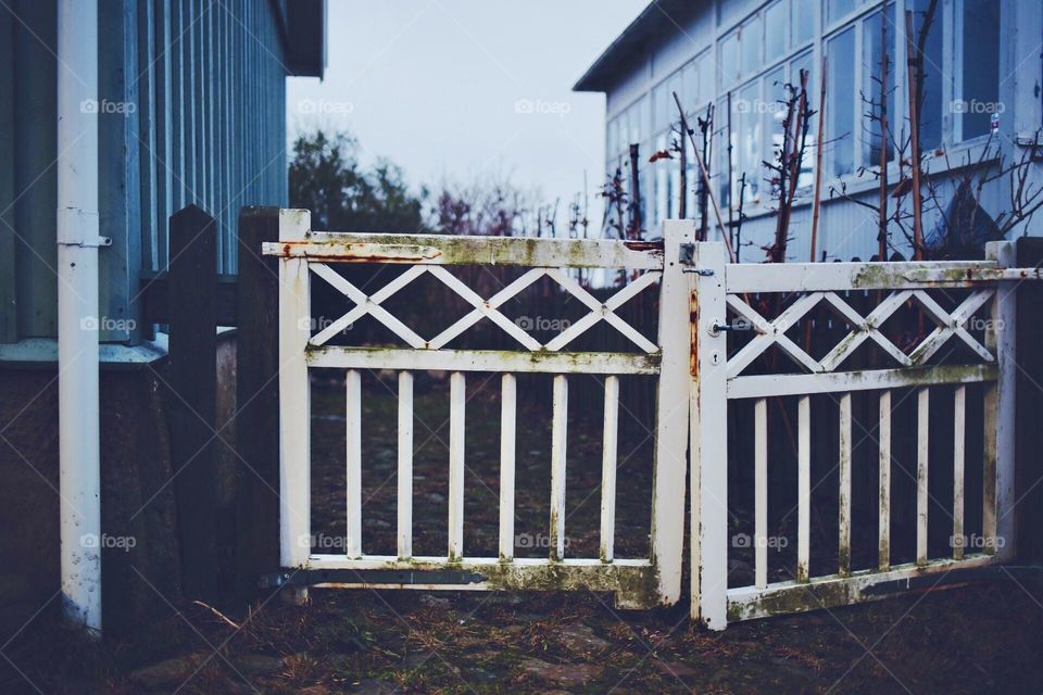 Beautiful vintage fence in front of the old house 