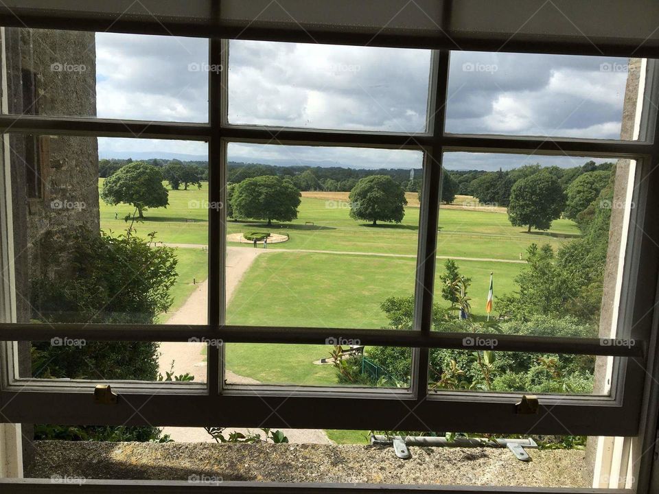 View from a window overlooking Irish castle grounds