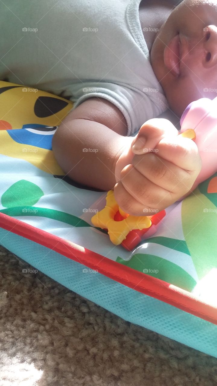 Baby's Frist Grasp with His New Toy