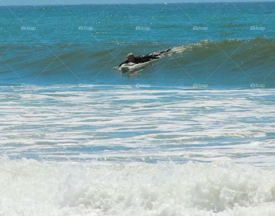 She waited nearly a half hour in this cold water off the coast of Oregon for the perfect wave!!