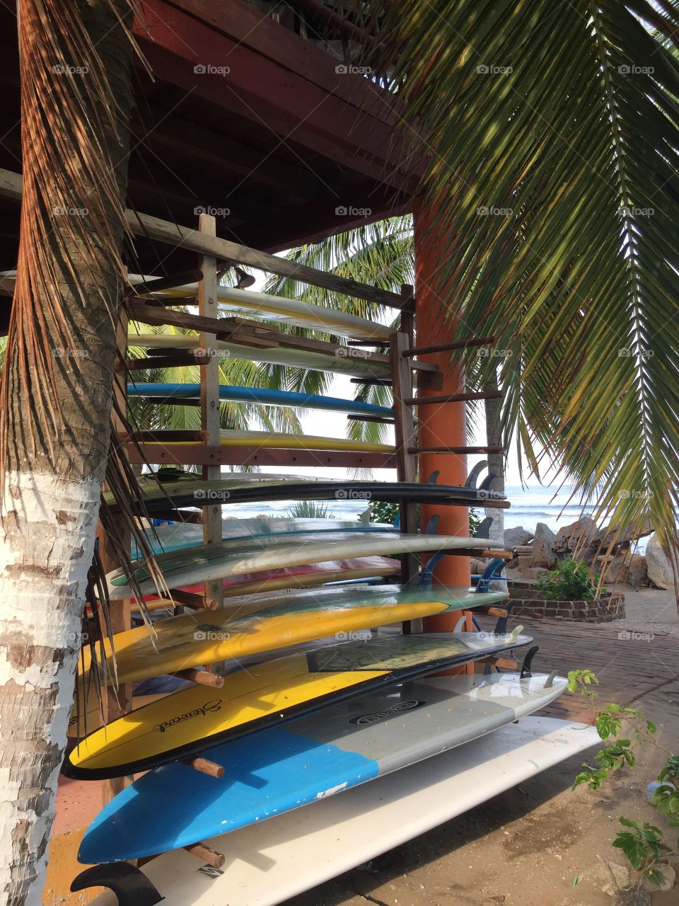 Surfboards on rack at beach