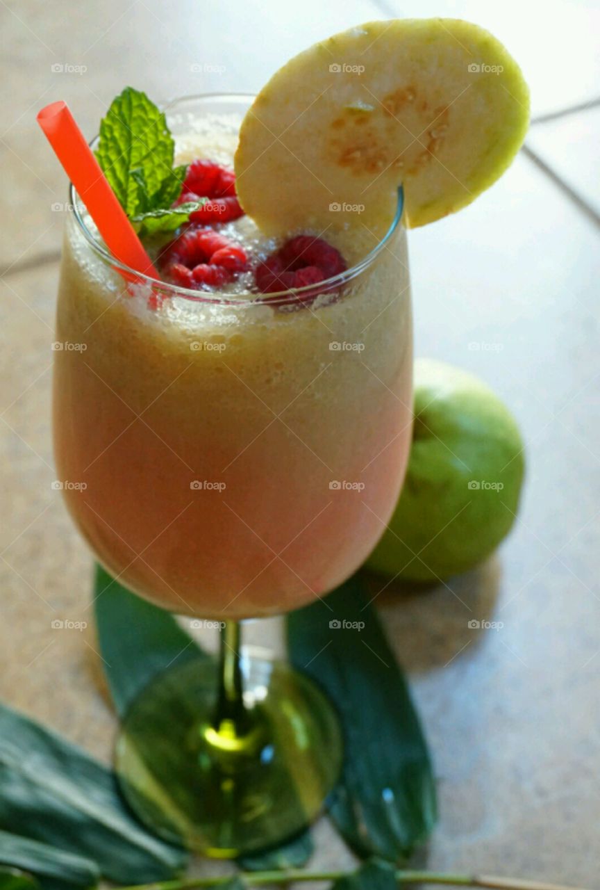 Fresh Fruit Smoothie - Guawa-Pink Lemonade Smoothie topped with raspberries and mints