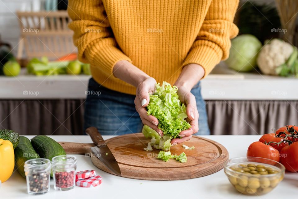 woman making salad