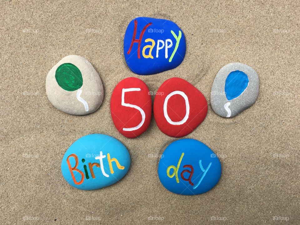 Happy 50 Birthday on colored stones
