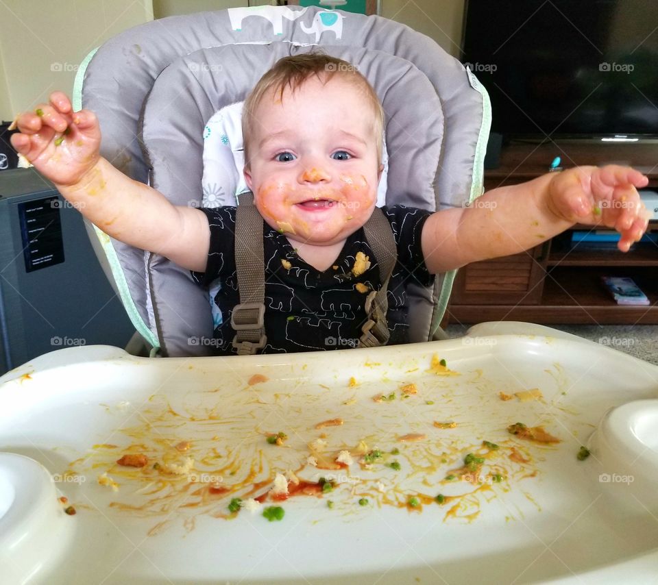Cute baby eating messy food