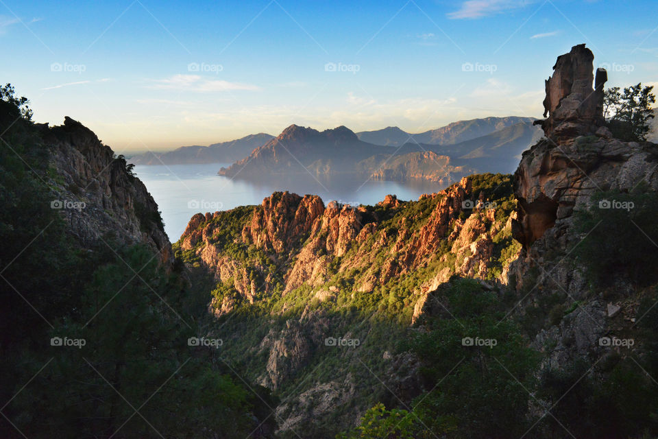 Scenic view of mountains and idyllic lake