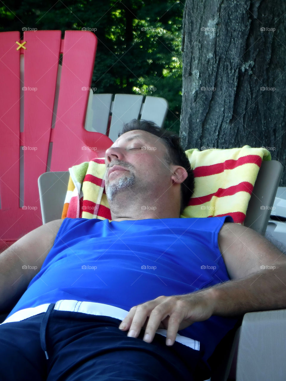 Man resting on chair