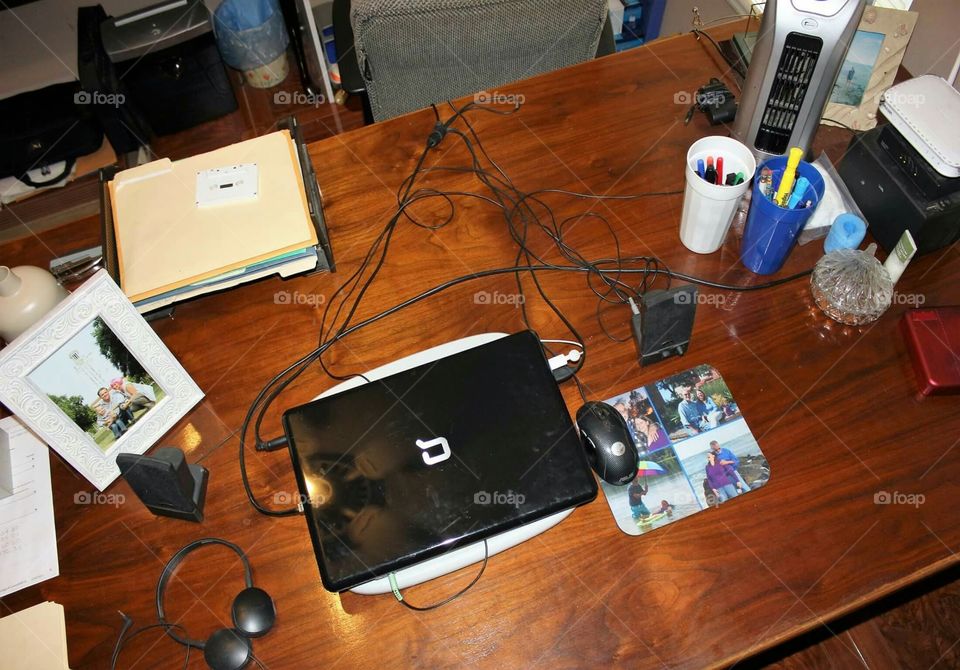 My husband's desk is big and messy!