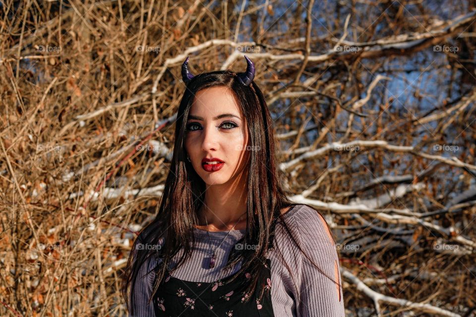 Winter maiden wearing horns 