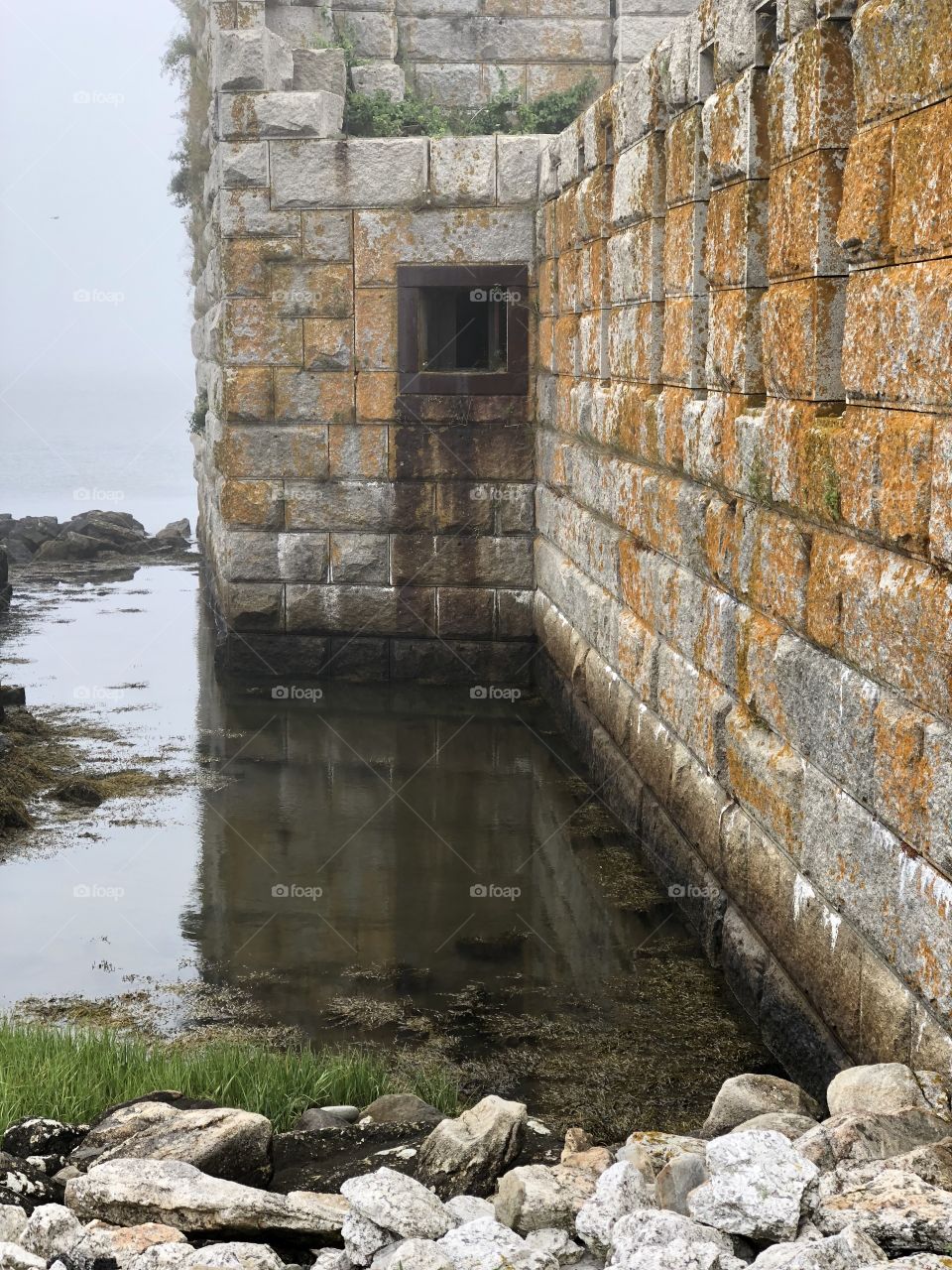 Could you ever escape from a place like this? The water becomes a murky afterthought as the rundown fort begins to look more like a prison than a shelter. 