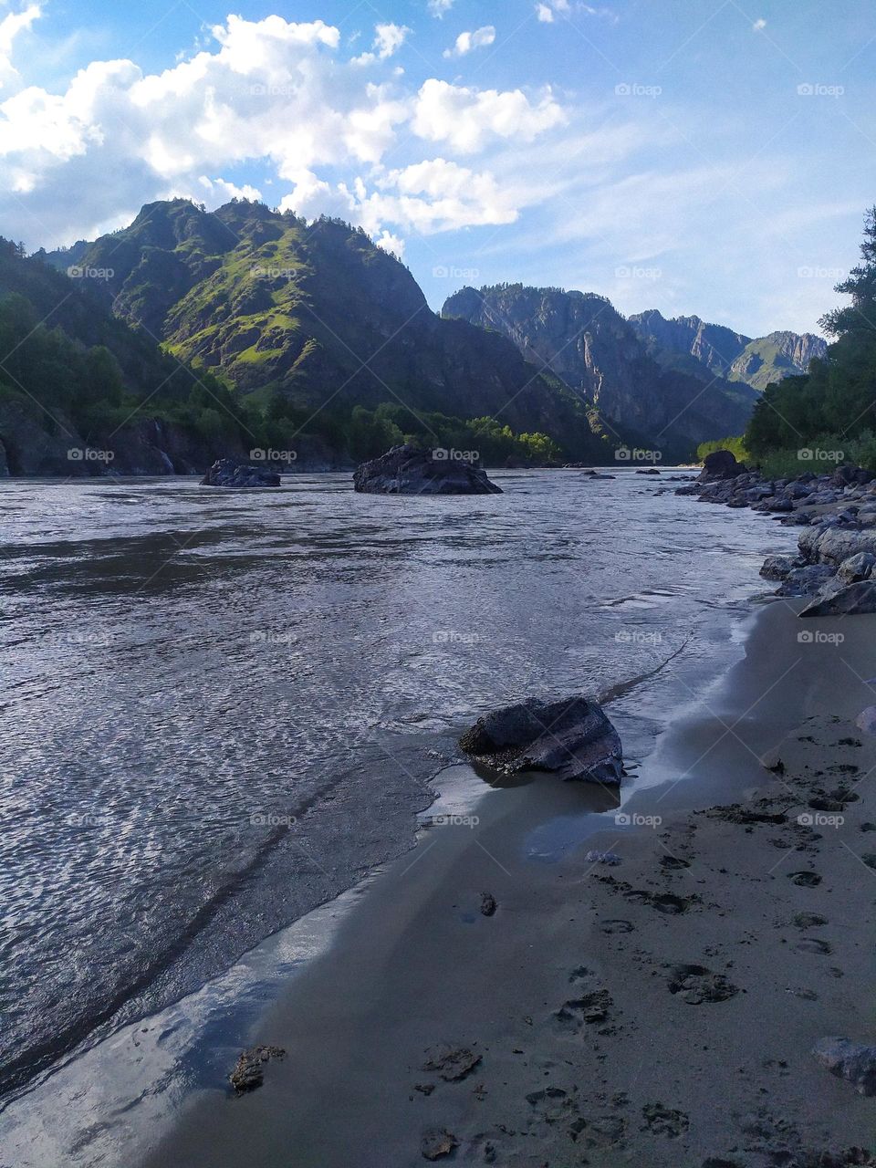 River at the foot of the mountain