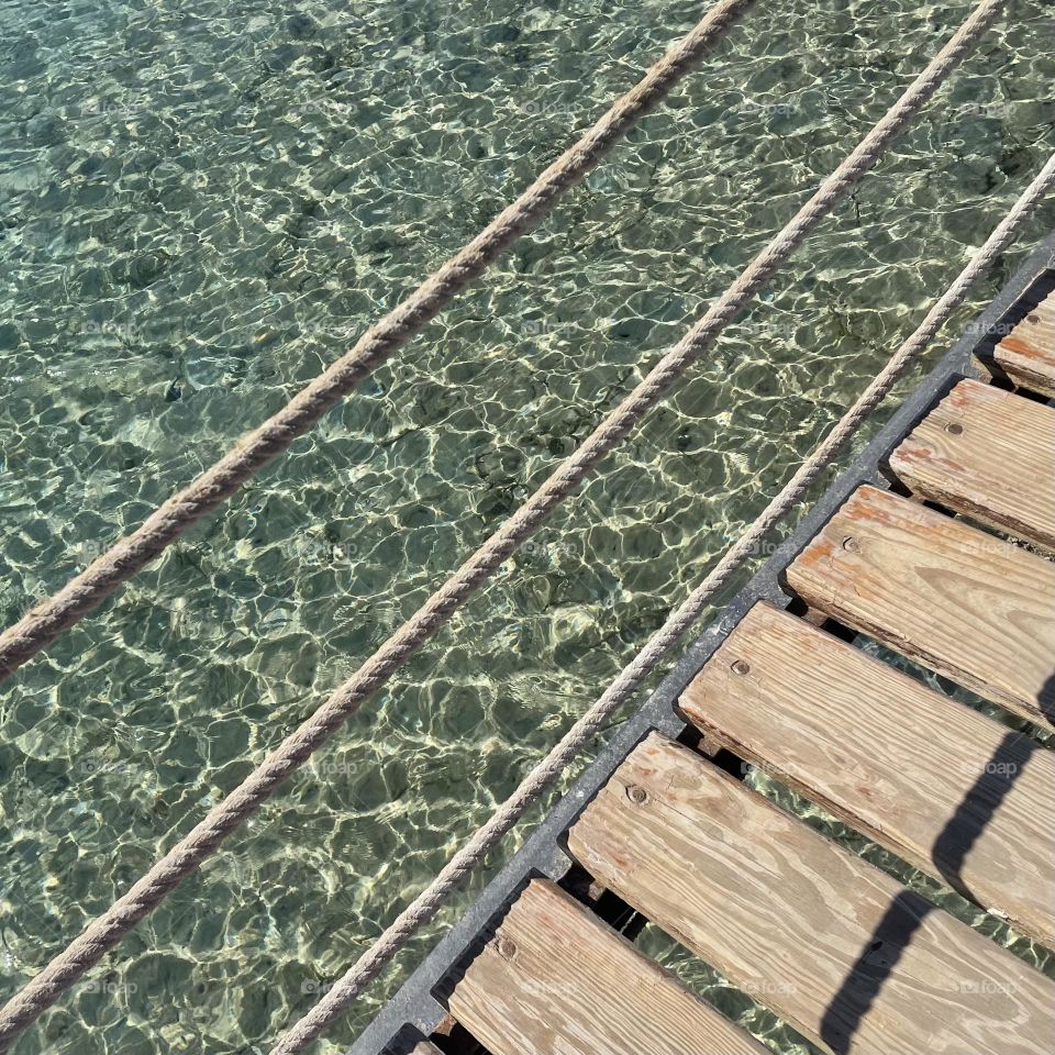 diagonal picture of sea and a bridge