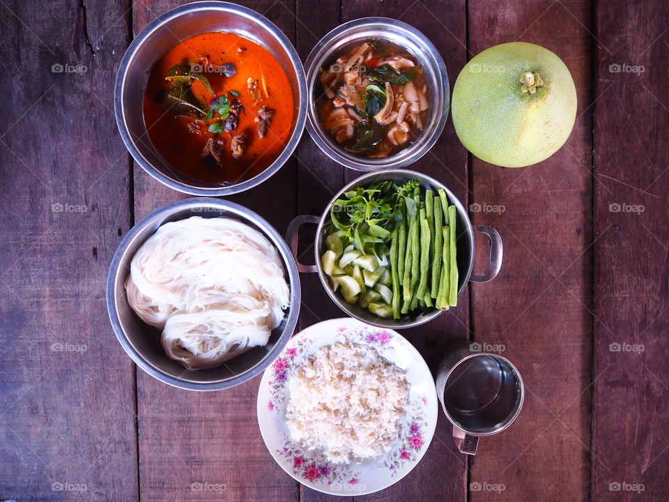rice and curry on wood table,thai food province