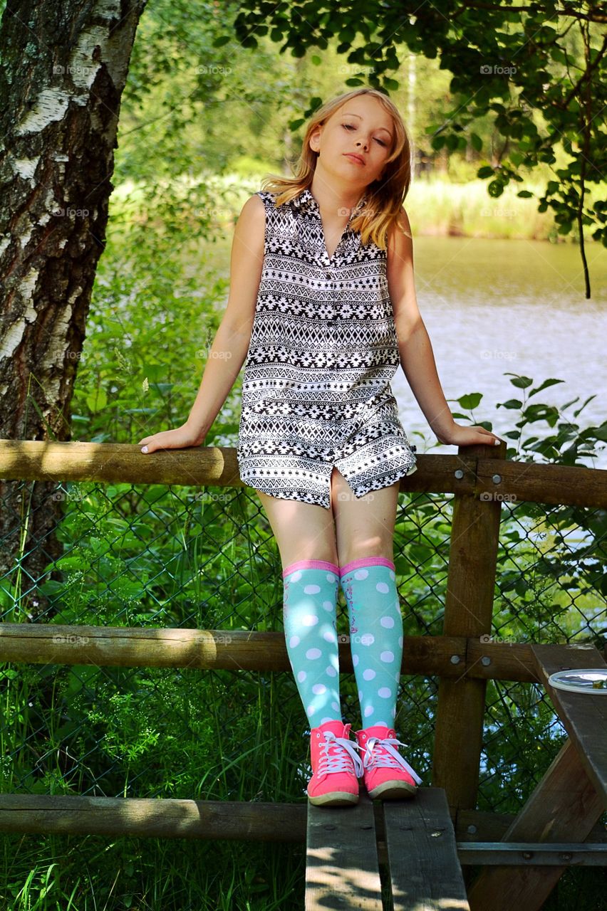 Girl. Girl sitting on the fence