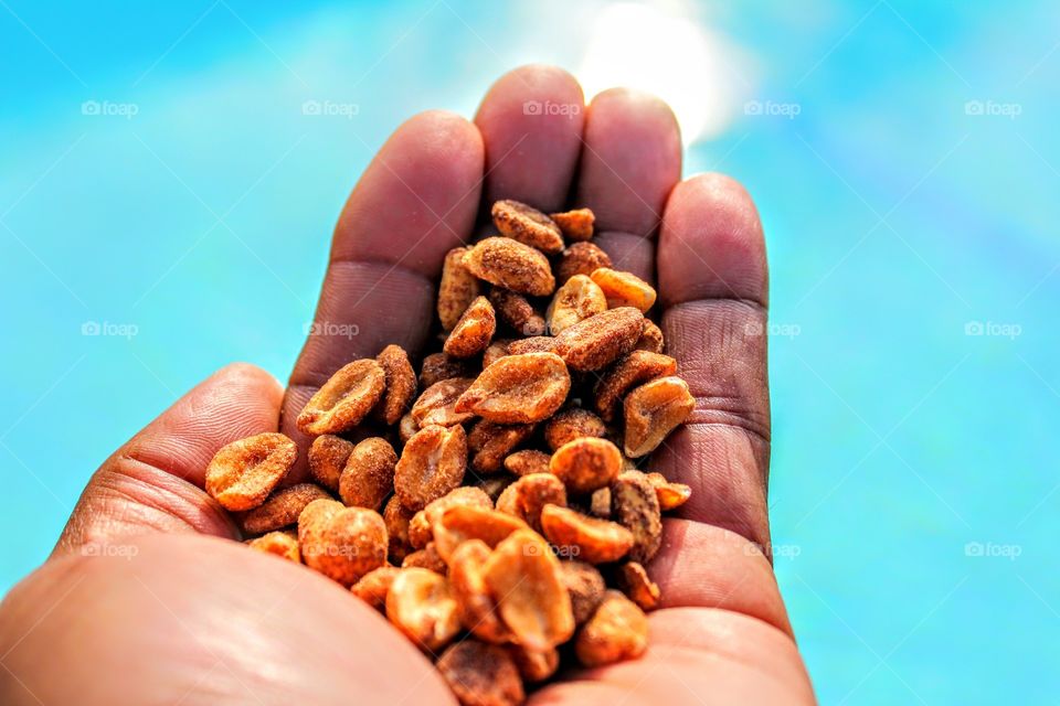 Roasted peanut in hand