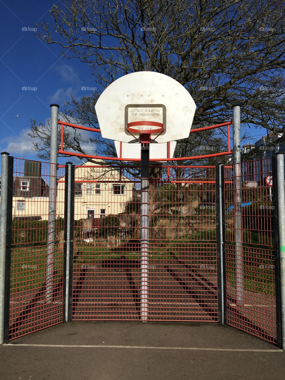 The colour impact when the sun hits an object. Large metal frame against a bright blue sky. 