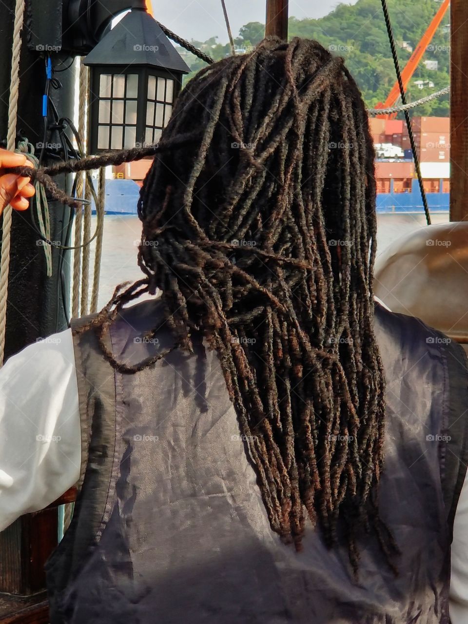Pirate ship worker with long hairbraids