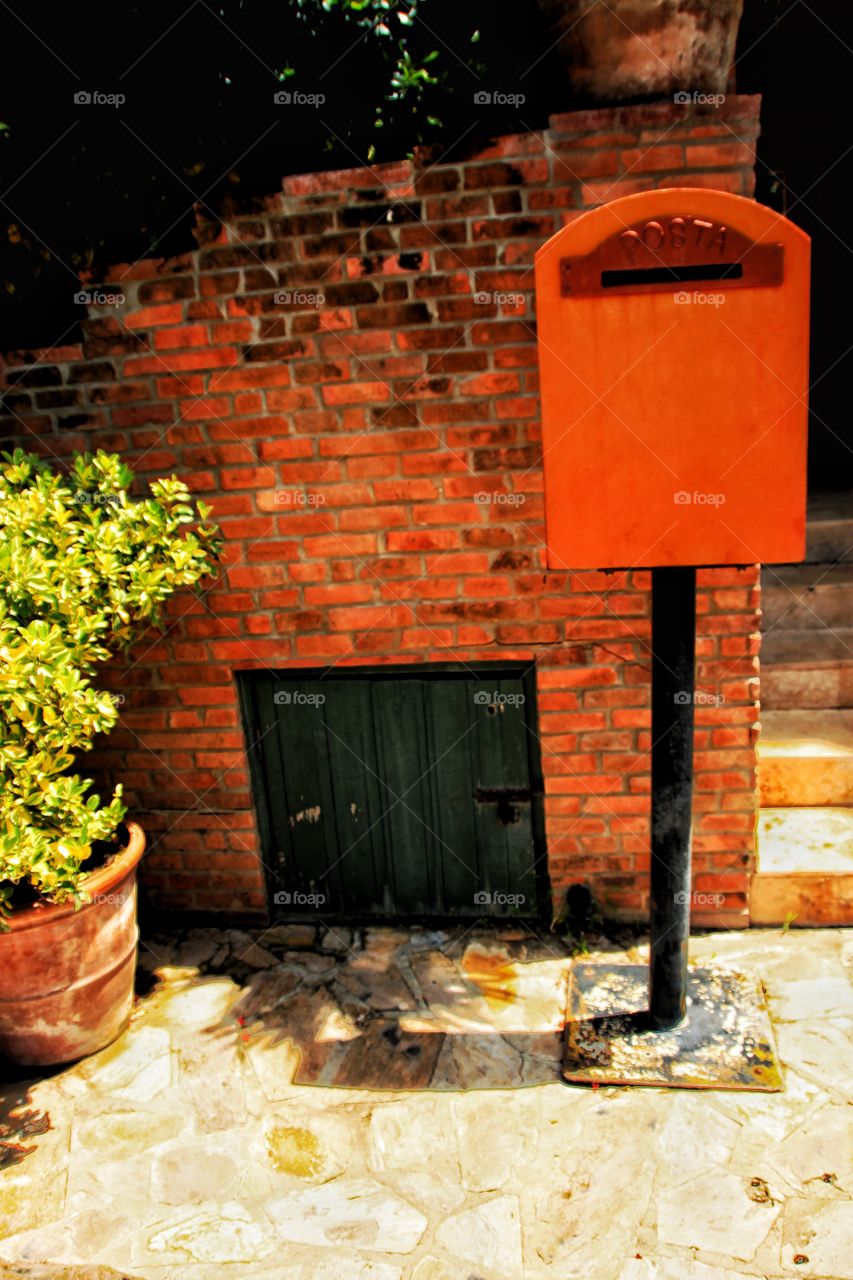 Red post box at home.