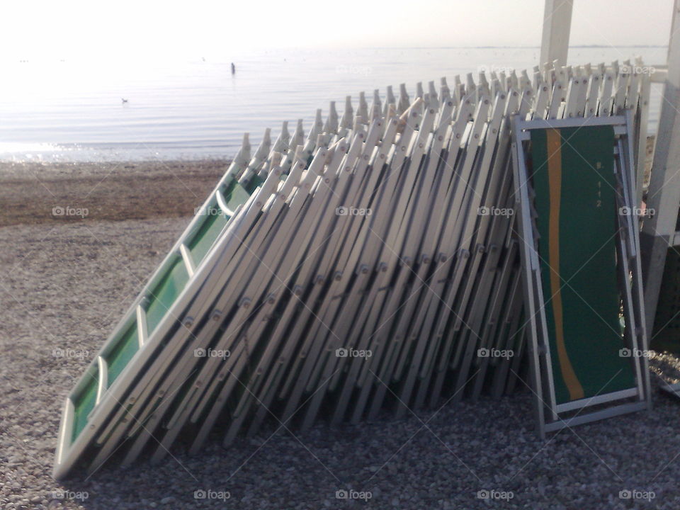 in the beach, lifeguard salvamento, deck chairs