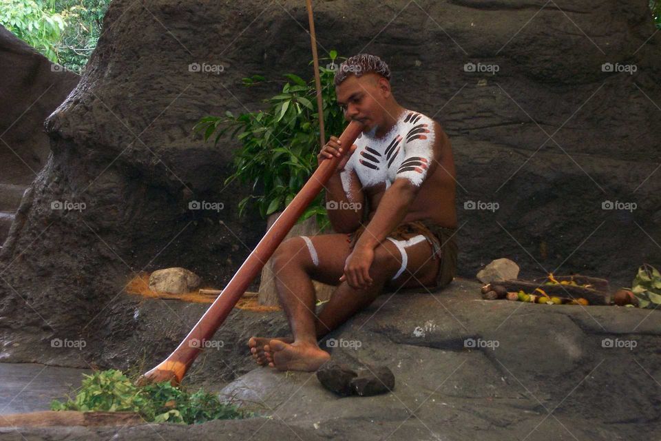 Aborigines playing digerry do