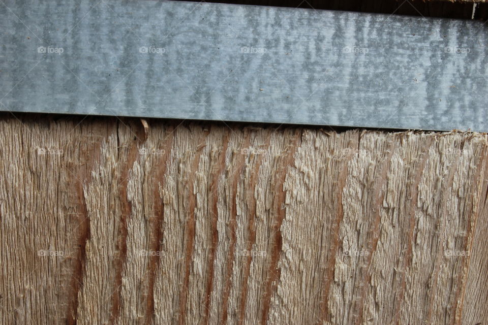 Wooden planter with metal band close-up