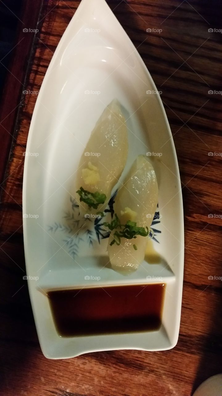 Escolar Sushi. nigiri sushi with fresh minced garlic on top