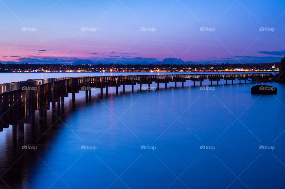 The boardwalk at dusk . Boardwalk during sunset and blue hour