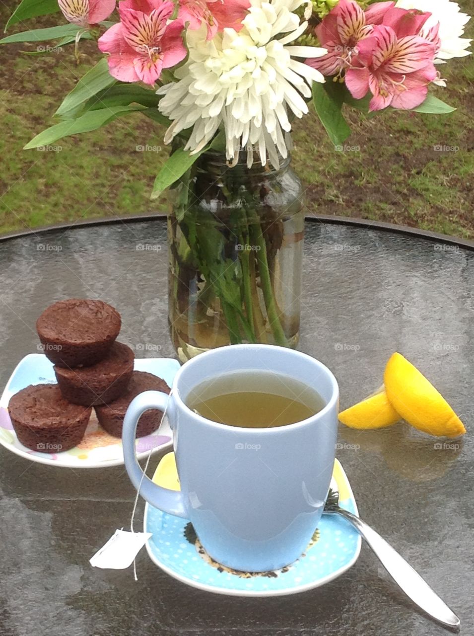 Having a cup of tea outdoors enjoying the beautiful Spring weather.